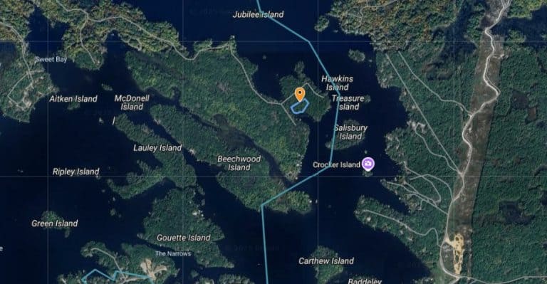 Scenic lakefront property in Ontario with cottage and island views, ideal for relaxation and outdoor.